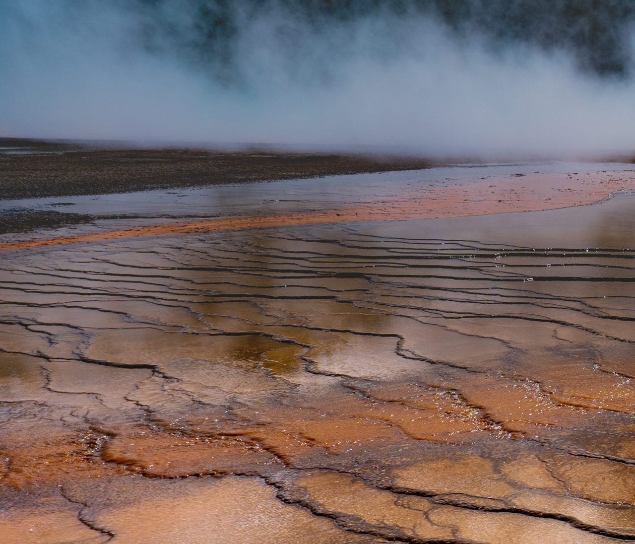 Vibrant orange layers surrounding Grand Prismatic Spring