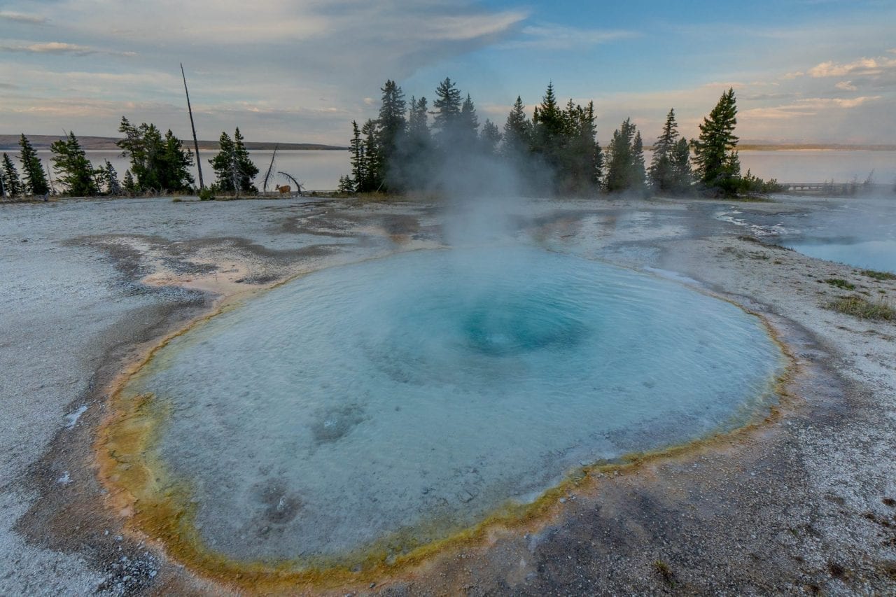 Geyser erupting in West Thumb area in Yellowstone